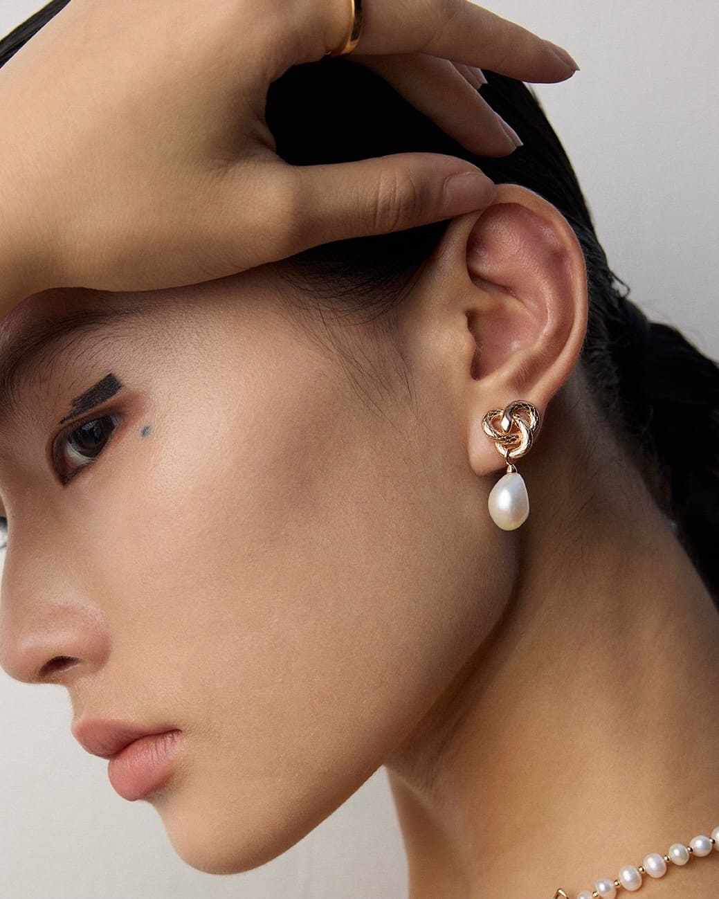 Serpentine Baroque Pearl Earrings | Sculptural Mystery in Vintage Gold